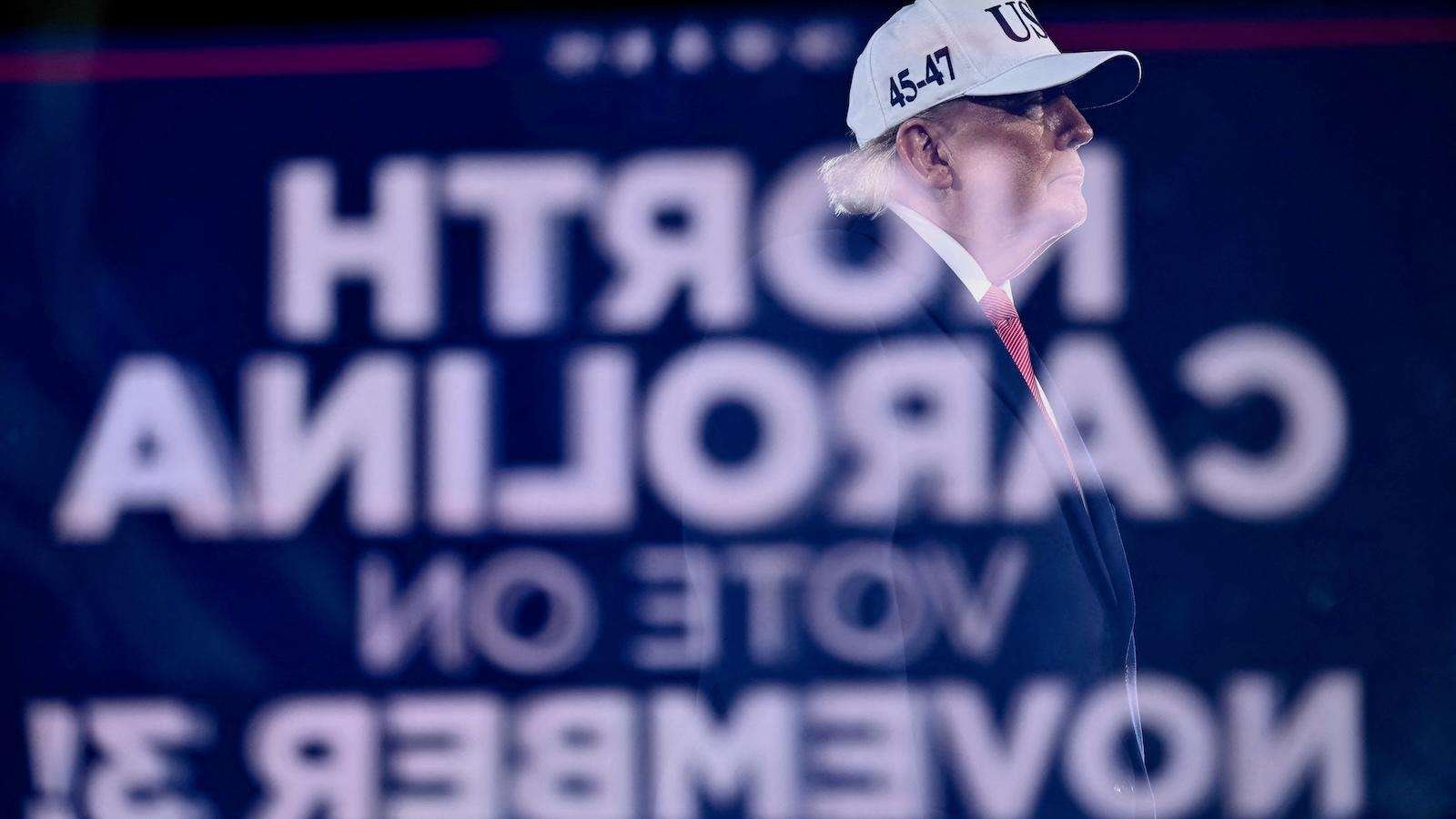 US President Donald Trump looks on at a midterm campaign rally at Pitt-Greenville Airport in Greenville, North Carolina, on October 20, 2026.