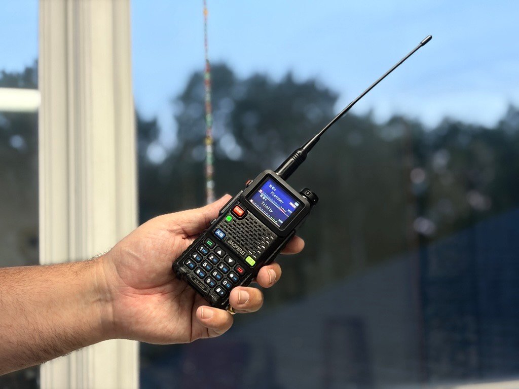 A man holds a radio