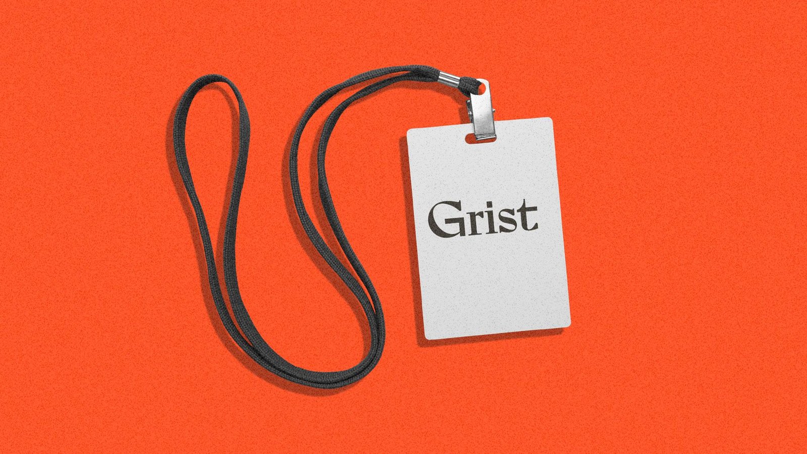 A Grist press pass on an orange background